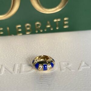 Pandora Egyptian Styled Radiant Shine 18 K
Gold and Blue Enamel CZ Charm
